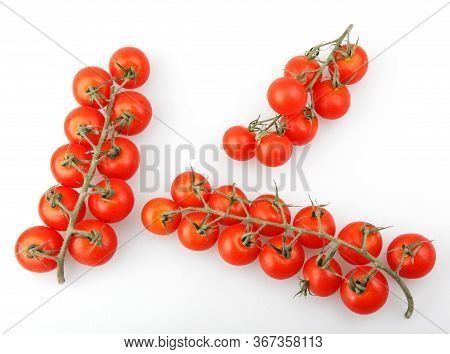 Fresh Organic Cherry Tomatoes Isolated On White Background. The Cherry Tomato Is Regarded As A Botan