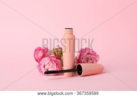 Macara And Flowers On Pink Background. Female Accessories