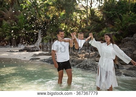 Happy Smile European Family Have Rest And Run On White Sand Beach