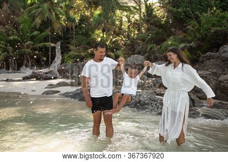 Happy Smile European Family Have Rest And Run On White Sand Beach
