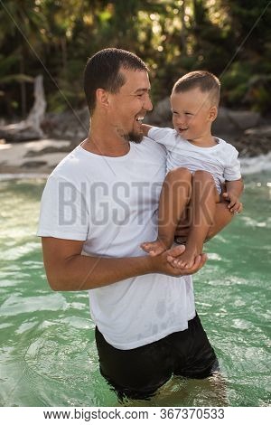 Happy Smile European Family Have Rest And Run On White Sand Beach