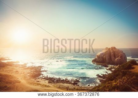 Rocky Island Near Coastilne Of Pacific Ocean In Chile