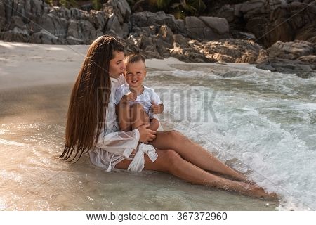 Happy Smile European Family Have Rest And Run On White Sand Beach