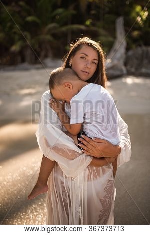 Happy Smile European Family Have Rest And Run On White Sand Beach