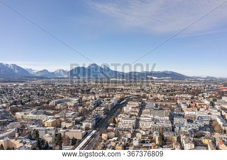 Aerial Drone Shot View Of Salzburg Mulln-altstadt Railway Station With View Of Alps Mountain Range U