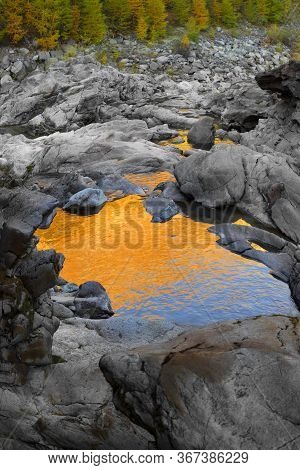 Waterfall In The Alps In The Province Of Morteratsch, Near The Famous Railway. Autumn Trees Over The
