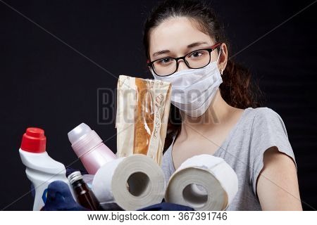 Young Woman In Protective Mask With A Bag Full Of Groceries From The Supermarket