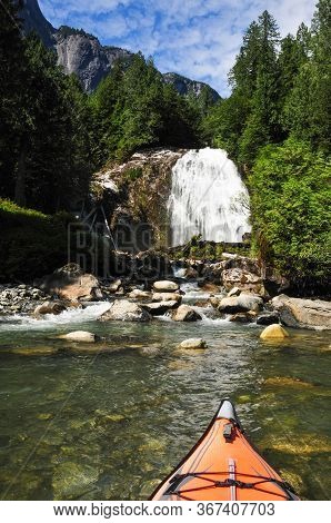 Adenturous Kayaking In A Calm Ocean Bay At The Base Of A Waterfall. Taken At Princess Louisa Inlet I