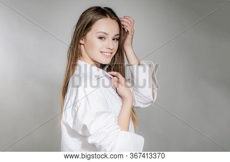 Young Beautiful Cute Cheerful Girl Smiling Looking At Camera Over Grey Background. Attractive Beauty