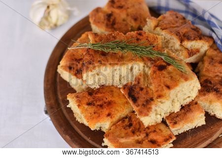 Homemade Italian Focaccia Modenese, With Rosemary And Olive Oil/ Freshly Baked Flat Bread Whit Herbs