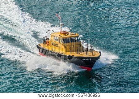Miami, Fl, United States - April 28, 2019: Miami Based Pilot Boat Guiding A Ship Out To Sea And Used