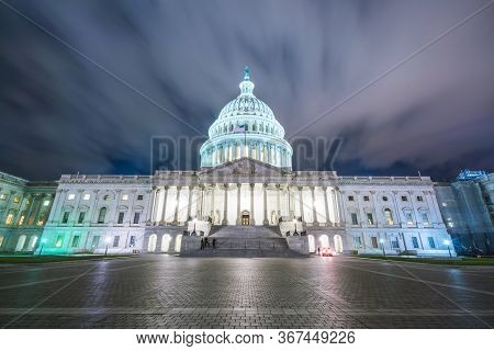 The United States Capitol Building At Night.