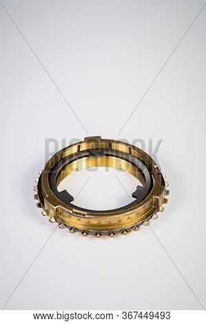 The New Gearbox Is Switched On In The Gearbox On A Gray Background. Components For Repairing The Gea