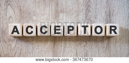 Acceptor - Text On Small Wooden Cubes On A Natural Table