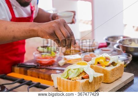 Professional Chefs Cooking And Preparing Street Food Called Bunny Chow At Food Festival