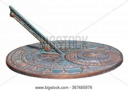 Antique Sundial With A Beautiful Dial And Ornament Isolated On White Background. The Bronze Oxidized