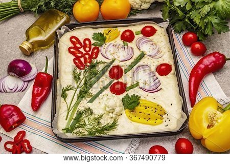 Raw Garden Focaccia. Fresh Dough And Vegetables, Olive Oil, Greens