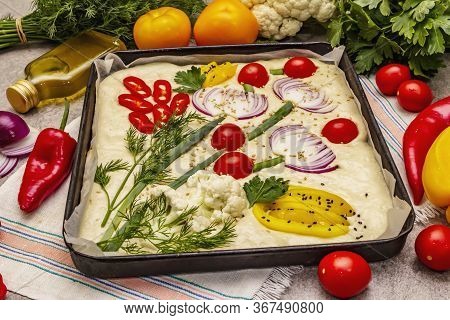 Raw Garden Focaccia. Fresh Dough And Vegetables, Olive Oil, Greens