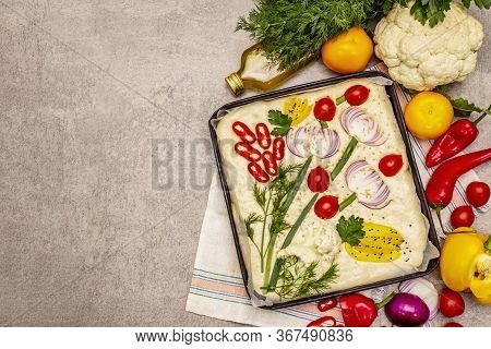Raw Garden Focaccia. Fresh Dough And Vegetables, Olive Oil, Greens