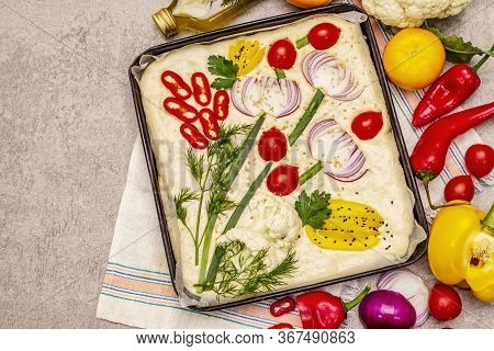 Raw Garden Focaccia. Fresh Dough And Vegetables, Olive Oil, Greens