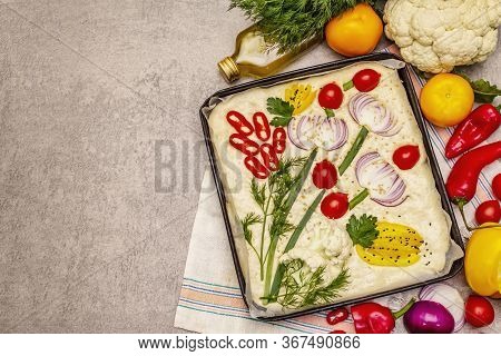 Raw Garden Focaccia. Fresh Dough And Vegetables, Olive Oil, Greens