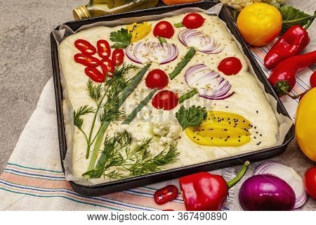 Raw Garden Focaccia. Fresh Dough And Vegetables, Olive Oil, Greens