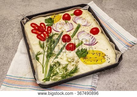 Raw Garden Focaccia. Fresh Dough And Vegetables, Olive Oil, Greens