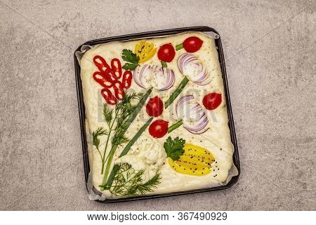 Raw Garden Focaccia. Fresh Dough And Vegetables, Olive Oil, Greens