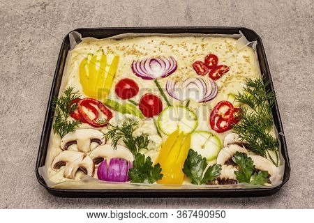Raw Garden Focaccia. Fresh Dough And Vegetables, Olive Oil, Greens
