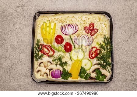 Raw Garden Focaccia. Fresh Dough And Vegetables, Olive Oil, Greens