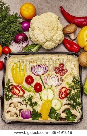 Raw Garden Focaccia. Fresh Dough And Vegetables, Olive Oil, Greens