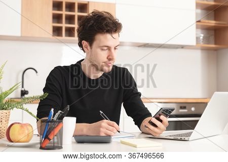 Man Using Laptop At Home. Job Search Or Remote Work Concept