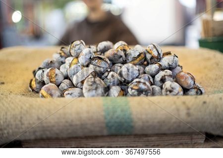 Tasty Roasted Chestnuts Sold On The Stall In Portugal