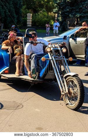 Kremenchug, Ukraine - September 22, 2018: Unknown People Rides Three Wheeled Motorcycle On A City Sq