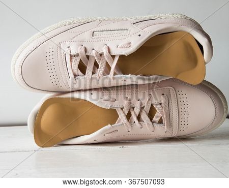 Pink Running Shoes With Orthopedic Insoles. White Background.