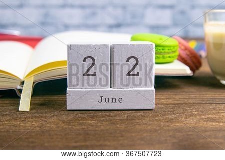 June 22 On The Wooden Calendar.the Twenty-second Day Of The Summer Month, A Calendar For The Workpla