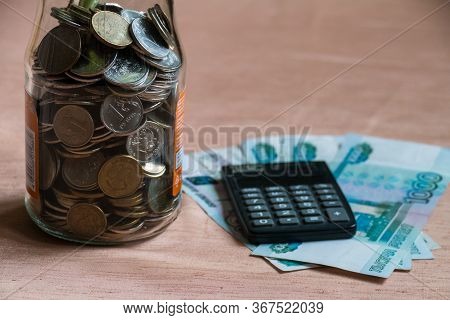 Glass Jar With Russian Manets, Calculator And Rubles
