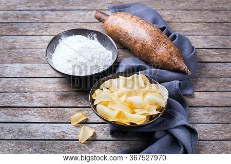 Brazilian Cuisine Food, Latin Snack. Yucca, Yuca, Cassava, Manioca Chips And Flour On A Table.