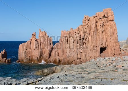 Sardinia Coastline: Typical Red Rocks And Cliffs Near Sea In Arbatax; Italy.