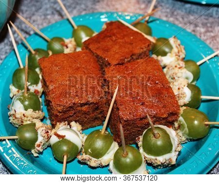 A Delicious Party Snack Plate Of Pumpkin Bread and Grapes