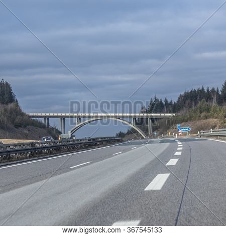 Empty Highway With Modern Bridge In Bavaria, Nabburg, Germany And Exit Sign (ausfahrt)