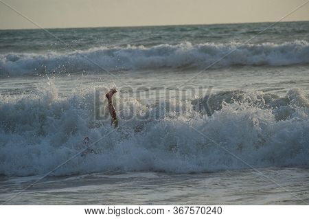 Young People Ride On Short Boards On The Waves. Extreme Sports And Hobbies. Ocean Waves. Funny Momen