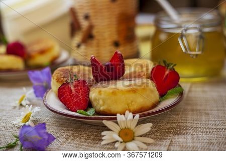 A Large Plate With Curd Cheese For Breakfast, Cottage Cheese Pancakes, Curd Fritters With Fresh Berr