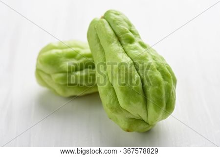 Chayote Squash Or Mirlition Squash On White Table, Organic Vegetable