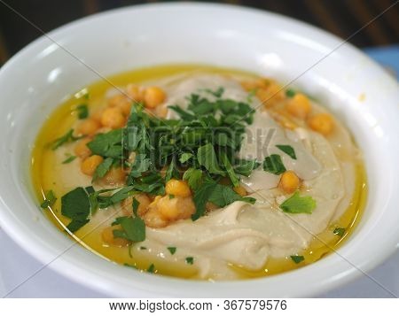Dish Of Fresh Hummus With Olive Oil And Parsley Middle East Arabic Food