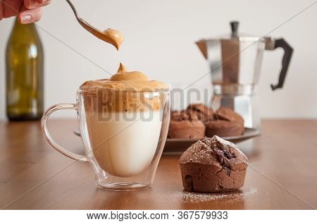Korean Coffee Dalonga Caffee And Chocolate Muffin On The Table. A Glass With Korean Coffee Dalonga C