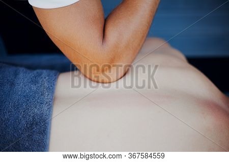 Deep Tissue Sports Massage With Therapist Using Elbow
