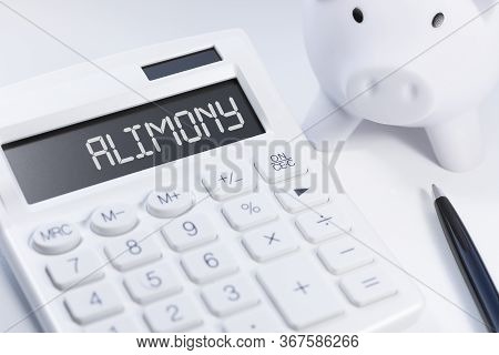 White Calculator, White Piggy And Black Pen With Text Alimony On White Background