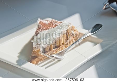 Delicious Yummy Light New York Cheese Cake In White Square Platre And Silver Spoon