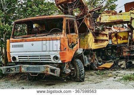 Old Abandoned Rusty Wrecked Kamaz Car. Kamaz In A Landfill.